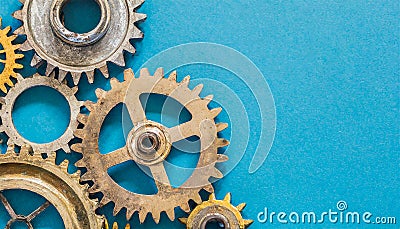 Machine cogs on a blue background. Stock Photo