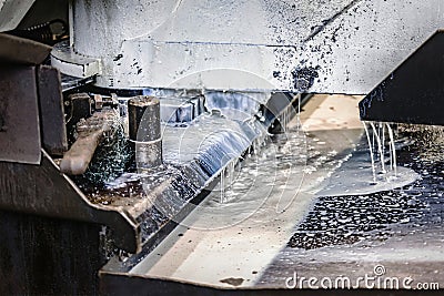 Machine for cutting metal profile. The saw cuts metal blanks into pieces. Industrial equipment for cutting and processing metal Stock Photo