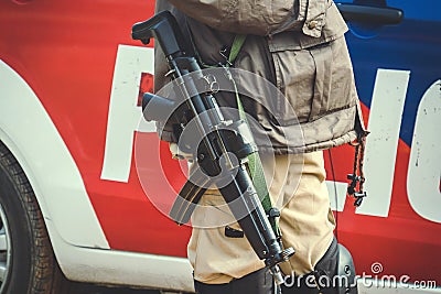 machine gun on a COP's shoulder. Stock Photo