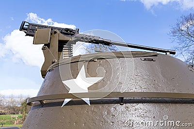 Machine gun on old american tank with blue sky Stock Photo