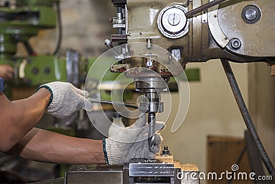 The machine operator change the cutting tool with NC milling machine Stock Photo