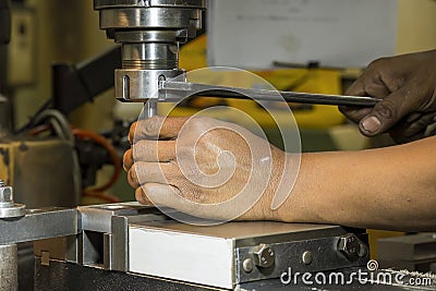 The machine operator change the tool at NC milling machine Stock Photo