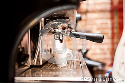 Machine preparing espresso in coffee shop Stock Photo