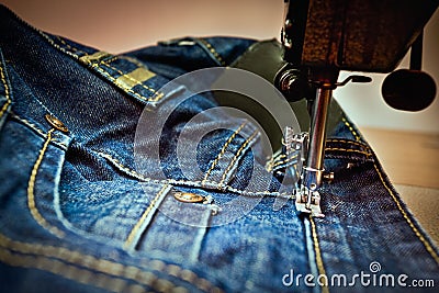 A machine sewing a jean Stock Photo