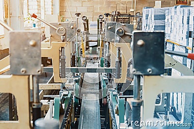 Machine for stitching sheets of paper in the printing. Magazine, brochure, book. Production of printed products. Vintage Stock Photo