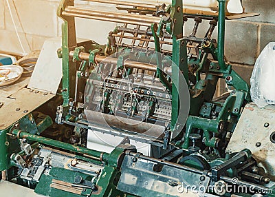 Machine for stitching sheets of paper in the printing. Magazine, brochure, book. Production of printed products. Vintage Stock Photo