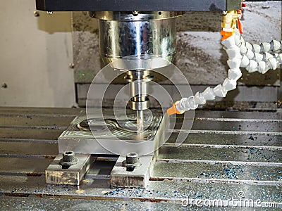 Machining precision part by CNC machining cente Stock Photo