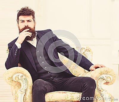 Macho attractive and elegant on serious face and thoughtful expression. Man with beard and mustache wearing classic suit Stock Photo