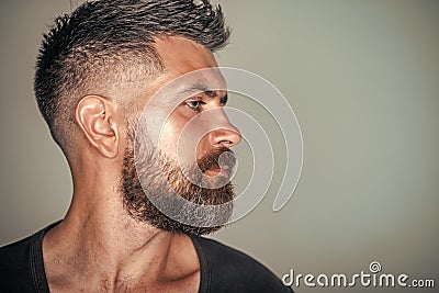 Macho with bearded face profile and stylish hair Stock Photo