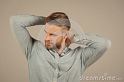 Macho in blue fashionable shirt, fashion. Man with bearded face and blond hair, haircut. Mens fashion style and trend Stock Photo