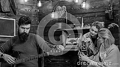 Macho with brutal face holding electric guitar. Bearded man playing musical instrument. Man with hipster beard Stock Photo