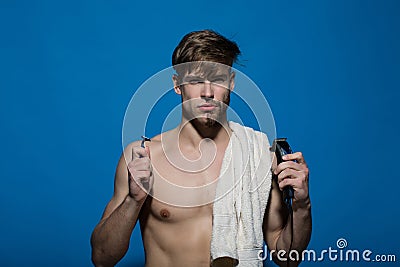 Macho with half bearded face, bath towel on muscular torso Stock Photo