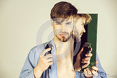 Macho with half shaven face chin and beard Stock Photo