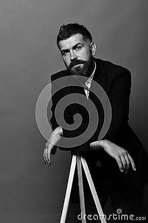 Man with beard wearing classic suit. Photography and profession concept Stock Photo