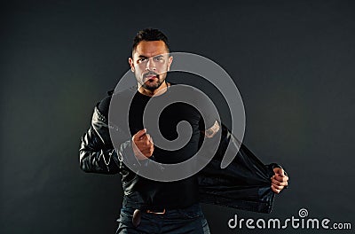 Macho undress leather jacket. Man with beard on unshaven face. Fashion model in casual style clothes. Style and trend Stock Photo