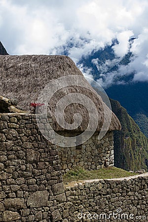 Machu Picchu grass roof stone bldg Stock Photo