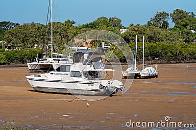 Boats Stranded On The Mud At Low Tide In A Creek Editorial Stock Photo