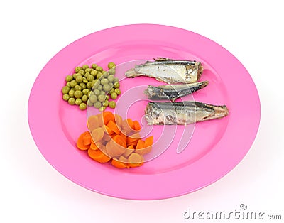 Mackerel carrots and peas on a pink dish Stock Photo