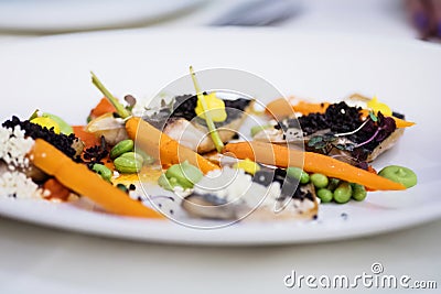 Mackerel fillets with baby carrots Stock Photo