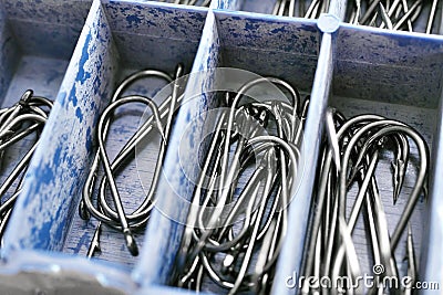 Macro of assorted fishhooks. Set of fishing hooks in tackle box Stock Photo