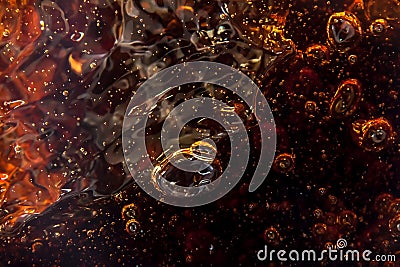 Macro black bubbles on the glass wall of cola Stock Photo