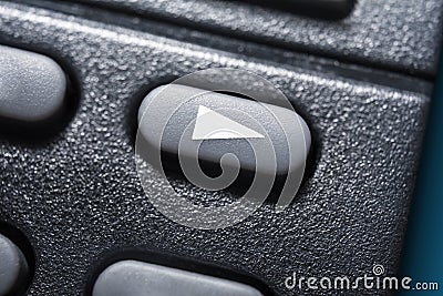 Macro Of A Black Play Button On Black Remote Control For A Hifi Stereo Audio System Stock Photo