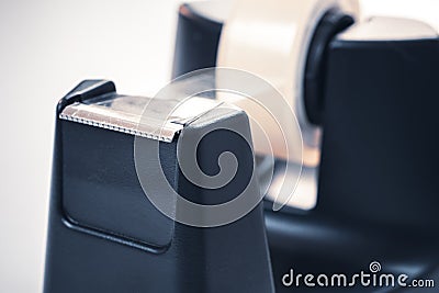 Macro Of A Black Sellotape Holder On A White Office Desk Stock Photo