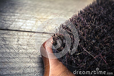 Macro Of A Brush With Long Hairs - Alopecia Hair Loss Concept Stock Photo