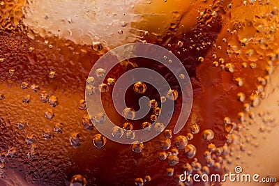 Macro of bubbles and fizz. A cool glass of cola drink with ice Stock Photo