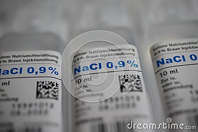 Macro close up of isolated 10 ml nacl sodium chloride 0,9 % infusion solution ampules Editorial Stock Photo