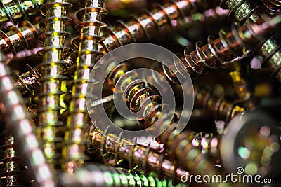 Macro close up of isolated pile metal crosshead screws in tool box Stock Photo