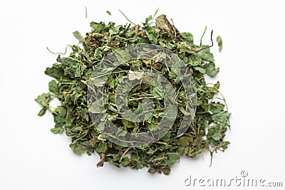 Macro close-up of Organic green dry Fenugreek leaves Trigonella foenum-graecum on white background. Stock Photo