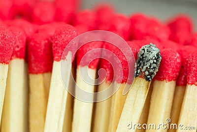 Macro close up of Red headed matches and one burnt Stock Photo