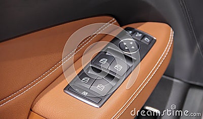 The macro close up view of command buttons on armrest on the driver door Stock Photo