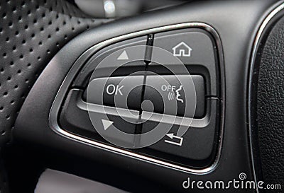 A macro close up view of command buttons on the steering wheel Stock Photo