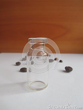 Macro composition with empty glass container and coffee beans Stock Photo