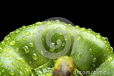 Macro cut shot of green bell pepper background with water drops Stock Photo