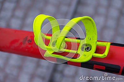 Macro detail of an acid yellow bike bottle cage Stock Photo