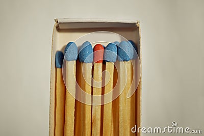 Macro detail of a box of matches matchbox full of matches with blue top and one different with a red top Stock Photo