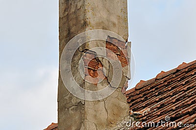 Deteriorated brick-made chimney Stock Photo