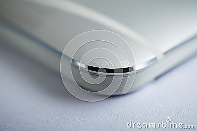 Macro detail of a silver brushed aluminum texture of sleek modern smart phone with shiny beveled edges Stock Photo