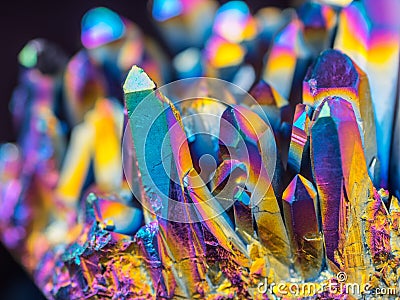 Macro detail of Titanium rainbow aura quartz crystal cluster stone with shallow depth of field Stock Photo