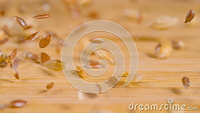 MACRO: A mix of wheat, sesame and flax seeds gets scattered across the table. Stock Photo