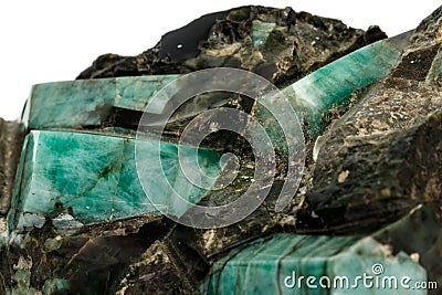 Macro emerald stone mineral in rock on white background Stock Photo