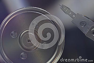 Macro Image of Hard Disk Spindle Hub and Read Write Head in Precision Alignment During Idle State Stock Photo