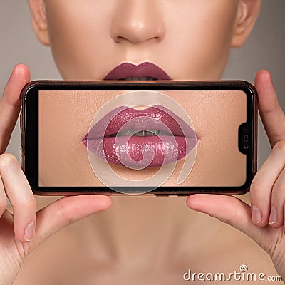 Macro perfect lip makeup. Macro photo of the face details. Lipstick shades of red. Gloss lips Stock Photo