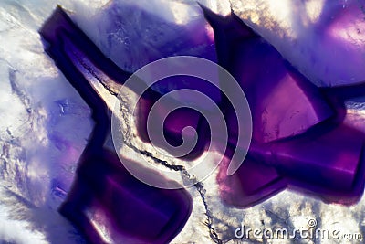 Macro photo of a colorful purple agate rock slice. Stock Photo