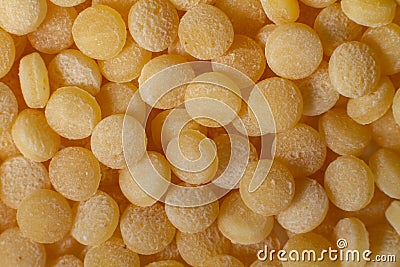 Macro photo couscous. Yellow grains of wheat grits, cuscus, semolina, universal porridge for breakfast Stock Photo