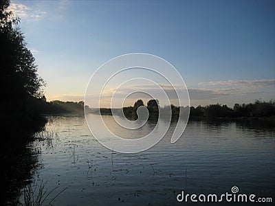 Macro photo with decorative background of rural sunset landscape on the river in beautiful gentle evening shades of light Stock Photo