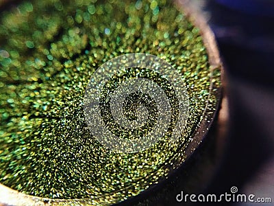 Macro photo green eye shadow pigment glitter gloss cosmetic make up Stock Photo